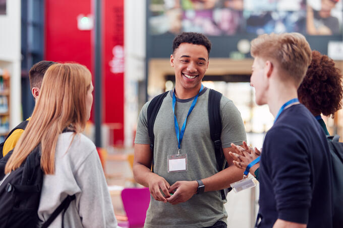 Group of young people talking together at an event