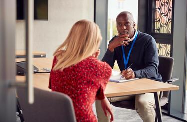 Man listens carefully to a woman