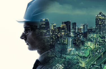 Workforce Person wearing a helmet and goggles merging into graphic of high rise buildings