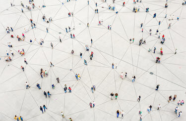 GettyImages-1180187740 People walking and interconnected with joined up lines on the ground