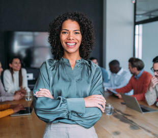 Solo woman professional in office smiling